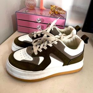 Brown and white athletic sneakers